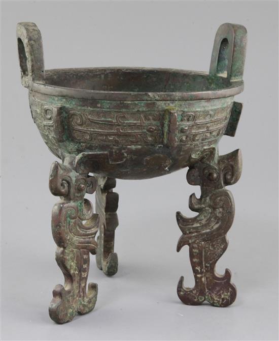 A Chinese archaic bronze tripod ritual food vessel, late Shang/early Western Zhou dynasty, 23cm high, repairs